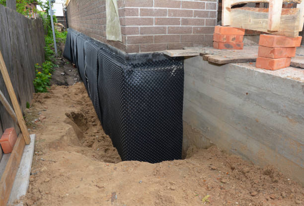 Happy homeowners after waterproofing job in Lansdale